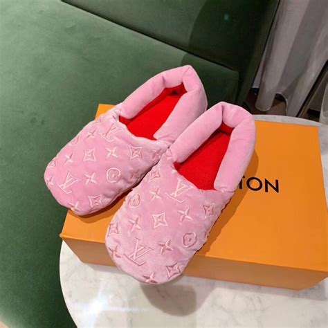 pink fluffy louis vuitton slippers.